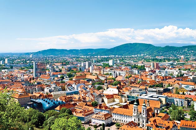 You can ascend the city pinnacle of Graz, Austria, via countless steps for a spectacular view of the red-tiled roofs below – or you can ascend via elevator within the mountain.