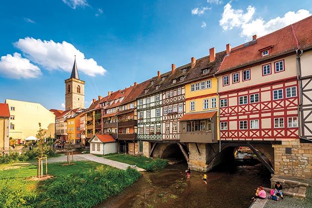 Merchants Bridge — built over the river in Erfurt, Germany in 1325 — is lined with picturesque homes and shops.