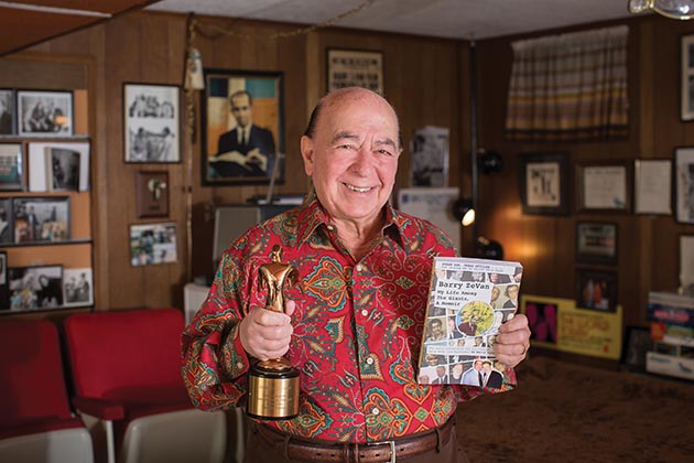 Barry ZeVan holds his new book and a Telly Award, bestowed on him in 2006 for executive producing the documentary American Indian Homelands: Matters of Truth, Honor and Dignity Immemorial, narrated by former news anchor Sam Donaldson.