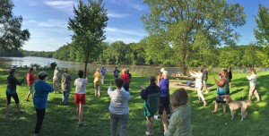During the summer months, Becketwood residents practice t’ai chi chih at Hidden Falls Regional Park in St. Paul. Photo by Don Darnutzer